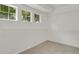 Walk-in closet with neutral carpet and bright, natural light from multiple windows at 17303 E Dewberry Cir, Parker, CO 80134