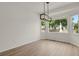 Bright dining room area with hardwood floors and large windows overlooking the yard at 17303 E Dewberry Cir, Parker, CO 80134