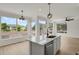 Bright kitchen featuring a kitchen island with stainless steel appliances and natural light at 17303 E Dewberry Cir, Parker, CO 80134