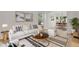 Elegant living room with stylish decor, featuring a cream sofa and wooden coffee table at 17303 E Dewberry Cir, Parker, CO 80134