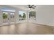 Spacious room with hardwood floors, lots of windows, and a ceiling fan at 17303 E Dewberry Cir, Parker, CO 80134