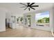 Open layout with stainless steel appliances, kitchen island, and sun-lit windows at 17303 E Dewberry Cir, Parker, CO 80134
