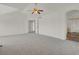 Expansive main bedroom featuring neutral carpeting, a ceiling fan, and ample space at 17303 E Dewberry Cir, Parker, CO 80134