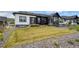 Beautiful backyard with lawn and modern two-story home at 8244 S Queen St, Littleton, CO 80127
