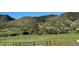 Rural land with views of nearby homes and sloping hillsides at 8244 S Queen St, Littleton, CO 80127