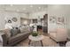 Spacious living area features modern furnishings, an open floor plan, and access to the kitchen at 8244 S Queen St, Littleton, CO 80127