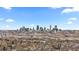 Aerial view of a home, displaying Denver's skyline in the distance at 75 S Knox Ct, Denver, CO 80219