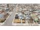 Aerial view showcases a charming home with a detached garage in a well-established neighborhood at 75 S Knox Ct, Denver, CO 80219