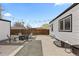 Charming backyard with a fire pit surrounded by pavers and gravel at 75 S Knox Ct, Denver, CO 80219