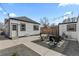 Quaint backyard featuring a fire pit and string lights for outdoor enjoyment at 75 S Knox Ct, Denver, CO 80219