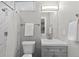 Bathroom featuring vanity and mirror, and updated shower at 75 S Knox Ct, Denver, CO 80219
