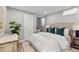 Cozy bedroom featuring soft colors, a comfortable queen-sized bed, and stylish decor at 75 S Knox Ct, Denver, CO 80219