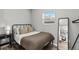 Cozy bedroom with ample natural light and minimalist decor at 75 S Knox Ct, Denver, CO 80219