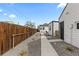 The exterior shows a well-maintained walkway and landscaping along the side of the home at 75 S Knox Ct, Denver, CO 80219