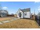 Charming home with modern landscaping and a walkway to the front door at 75 S Knox Ct, Denver, CO 80219
