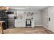 Modern kitchen with stainless steel appliances and white cabinetry at 75 S Knox Ct, Denver, CO 80219