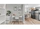 Desk area with a modern aesthetic, connecting to kitchenette and washer/dryer at 75 S Knox Ct, Denver, CO 80219