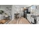 Living room includes a desk, table, and kitchen at 75 S Knox Ct, Denver, CO 80219