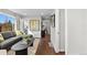 Bright living room featuring hardwood floors and comfortable gray sofa at 75 S Knox Ct, Denver, CO 80219