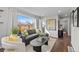 Sunlit living room features modern decor and a comfortable gray sectional sofa at 75 S Knox Ct, Denver, CO 80219