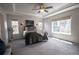 Bright main bedroom with carpeted floors and large windows at 6071 S Oswego St, Greenwood Village, CO 80111