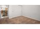 Carpeted bedroom with closet and doorway leading to another room at 13601 Krameria St, Thornton, CO 80602