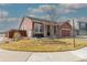 A cozy single-Gathering home showcasing a landscaped front yard and charming curb appeal with a covered porch at 13601 Krameria St, Thornton, CO 80602