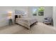 Cozy bedroom with natural light, a comfortable queen-sized bed, and neutral decor at 3329 Molly Ln, Broomfield, CO 80023