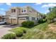 Exterior view of the property featuring the garage, lawn and stone facade at 3329 Molly Ln, Broomfield, CO 80023