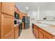 Kitchen with appliances, light countertops, and plenty of cabinet space at 3329 Molly Ln, Broomfield, CO 80023
