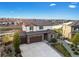 Desirable two-story home boasts a three-car garage, brick facade, landscaping, and a prime location near a pond at 7207 S Scottsburg Way, Aurora, CO 80016