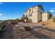 Back of home with a spacious backyard and composite deck with stairs at 7207 S Scottsburg Way, Aurora, CO 80016