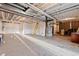 Large unfinished basement featuring concrete floor, exposed ceiling, ladder, and utility equipment at 7207 S Scottsburg Way, Aurora, CO 80016