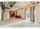 Spacious unfinished basement with exposed ceiling, concrete floor, and sliding glass doors to the backyard at 7207 S Scottsburg Way, Aurora, CO 80016