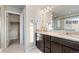 Bathroom with a double vanity, granite countertops, and walk-in shower at 7207 S Scottsburg Way, Aurora, CO 80016