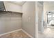Walk-in closet with ample storage space and neutral carpeting at 7207 S Scottsburg Way, Aurora, CO 80016
