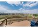 Relaxing deck overlooking a scenic pond and neighborhood, providing an ideal spot for outdoor enjoyment at 7207 S Scottsburg Way, Aurora, CO 80016
