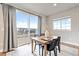 Sun-filled dining area with access to community views and access to a private balcony at 7207 S Scottsburg Way, Aurora, CO 80016