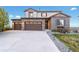 Charming home featuring a well-manicured lawn and three-car garage at 7207 S Scottsburg Way, Aurora, CO 80016
