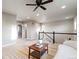 Open loft area with stylish furniture, natural light, and inviting ambiance at 7207 S Scottsburg Way, Aurora, CO 80016