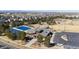 Aerial view of a community park with a clubhouse, swimming pool, playground, and open space at 24906 E Calhoun Pl # C, Aurora, CO 80016