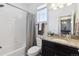 Clean bathroom featuring shower, tile, vanity, and large mirror at 24906 E Calhoun Pl # C, Aurora, CO 80016