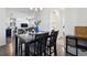 Elegant dining area showcasing a dark wood table, stylish décor, and seamless transition to the living spaces at 24906 E Calhoun Pl # C, Aurora, CO 80016