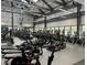 Modern fitness center with rows of treadmills, ellipticals, and stationary bikes in a well-lit space at 24906 E Calhoun Pl # C, Aurora, CO 80016