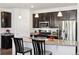 Beautiful kitchen featuring granite countertops, stainless steel appliances, and dark wood cabinetry at 24906 E Calhoun Pl # C, Aurora, CO 80016