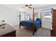 Spacious main bedroom with a four-poster bed, carpet, and modern ceiling fan at 24906 E Calhoun Pl # C, Aurora, CO 80016