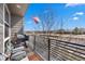 Balcony with seating and a grill, perfect for outdoor entertaining and enjoying the view at 15732 E Broncos Pl, Englewood, CO 80112