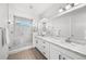 Elegant bathroom with double vanity, modern fixtures, and glass enclosed shower at 15732 E Broncos Pl, Englewood, CO 80112