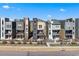 Modern townhomes with unique architectural details and well maintained landscaping at 15732 E Broncos Pl, Englewood, CO 80112