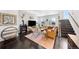 Cozy living room with a modern fireplace, stylish decor and comfortable seating at 15732 E Broncos Pl, Englewood, CO 80112